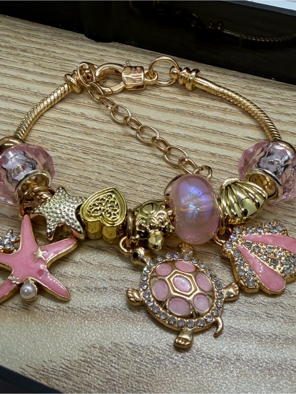 Gold-Tone Pink Charm Bracelet with Sea-Themed Charms